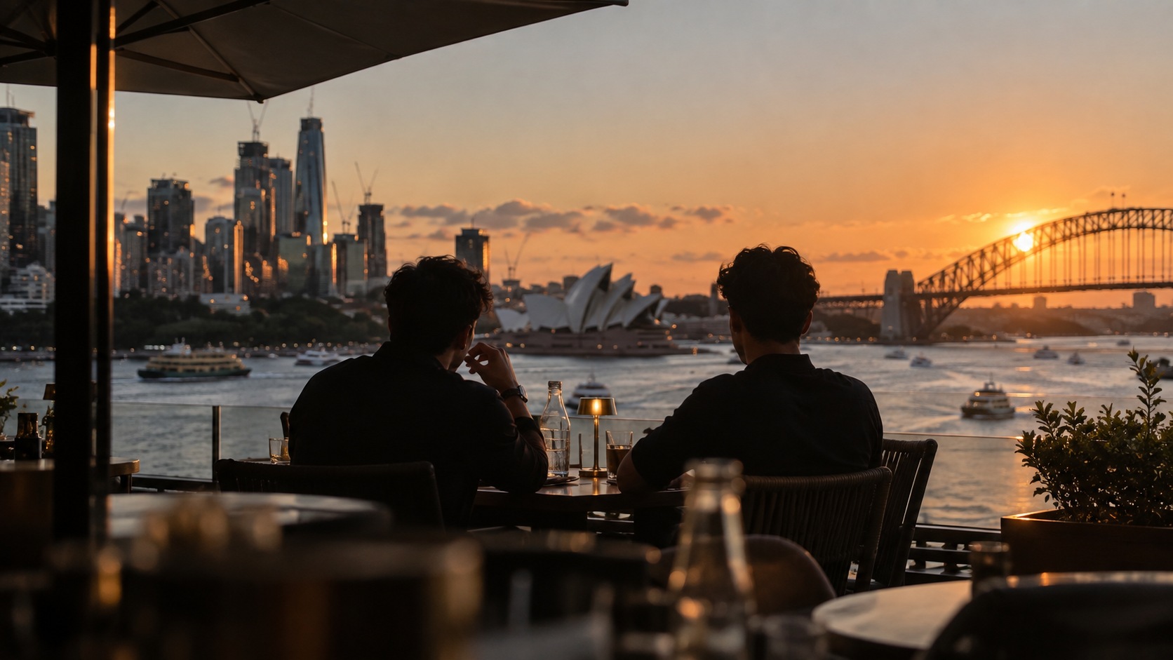 Two founders overlooking Sydney Harbour at sunset